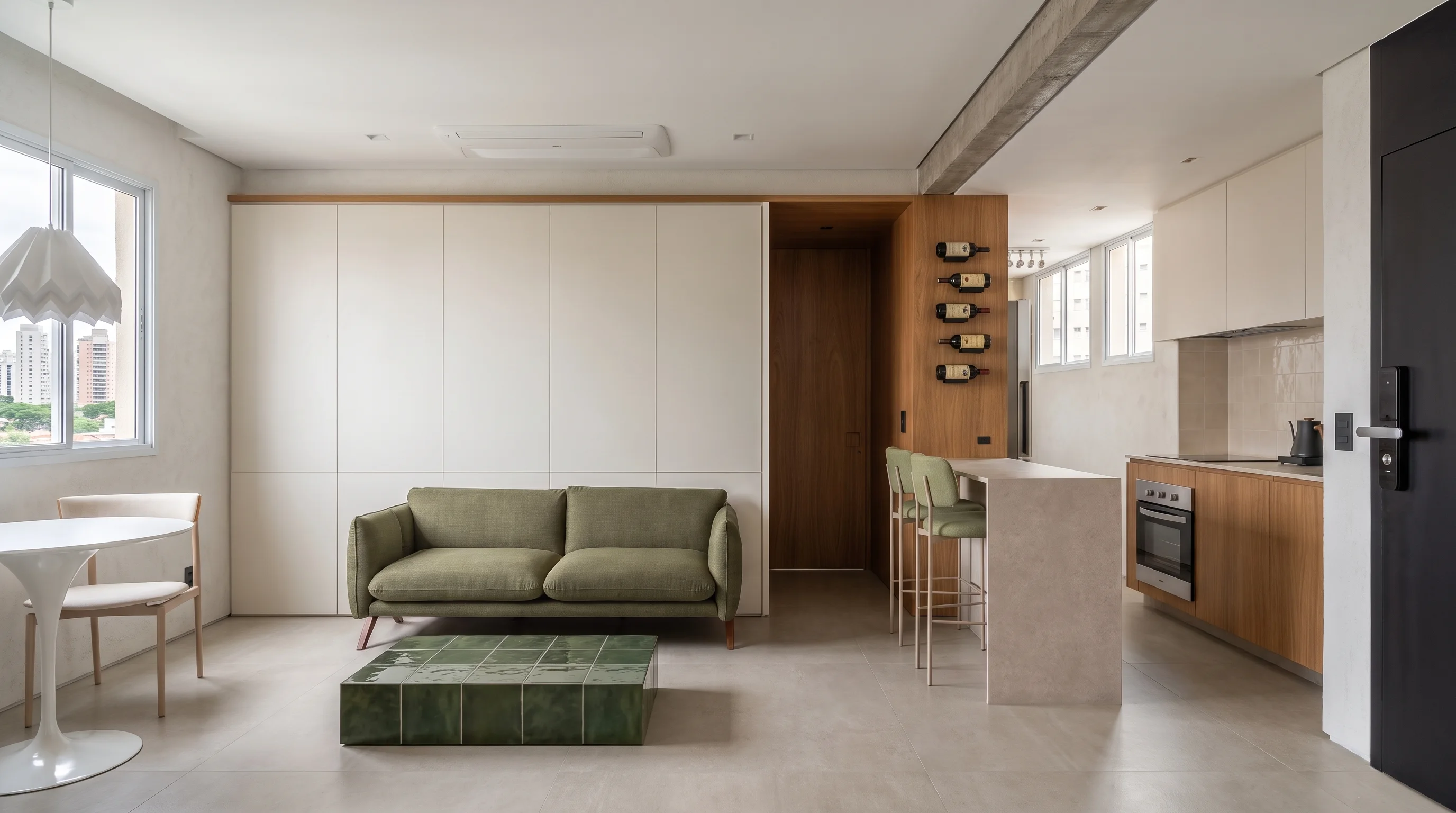 Vista amplia del salón y la cocina del Apartamento LNC, con madera repetida, superficies claras y acentos verdes suaves